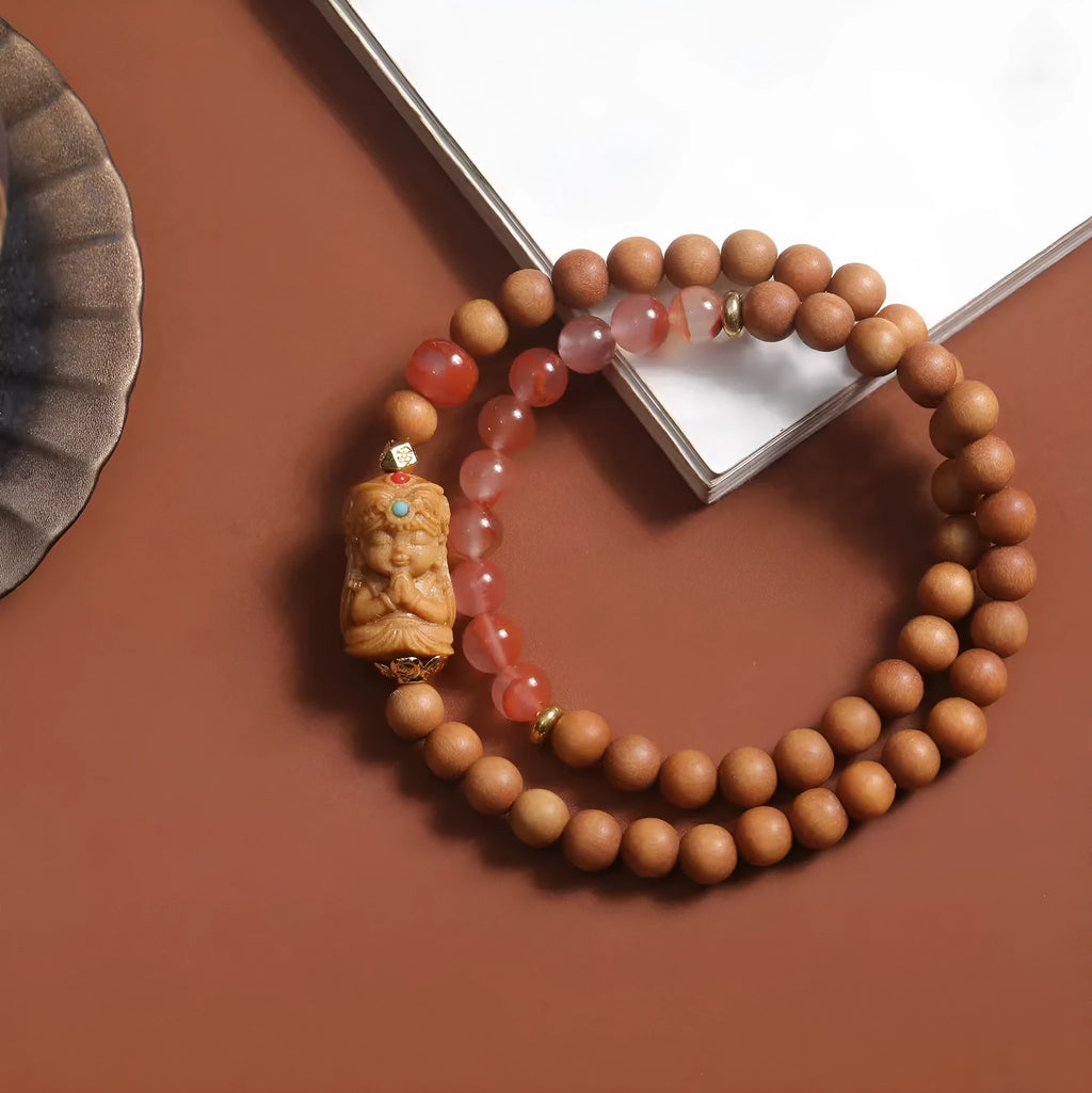 Brown wooden bracelet with 6mm round beads featuring a woven South Red Zachilam double circle design.