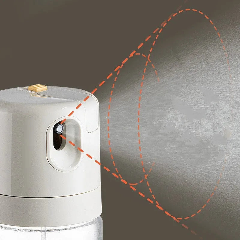 Warm grey glass oil spray bottle with dual-mode switch and automatic tilt-open lid