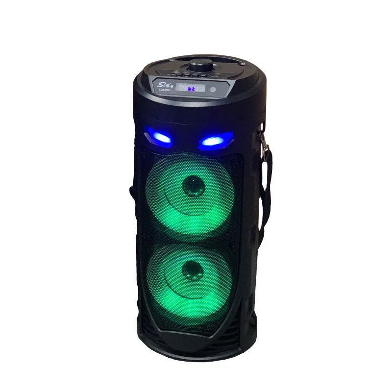 Black portable Bluetooth speaker with dual horn design and MP3 card slot on desktop