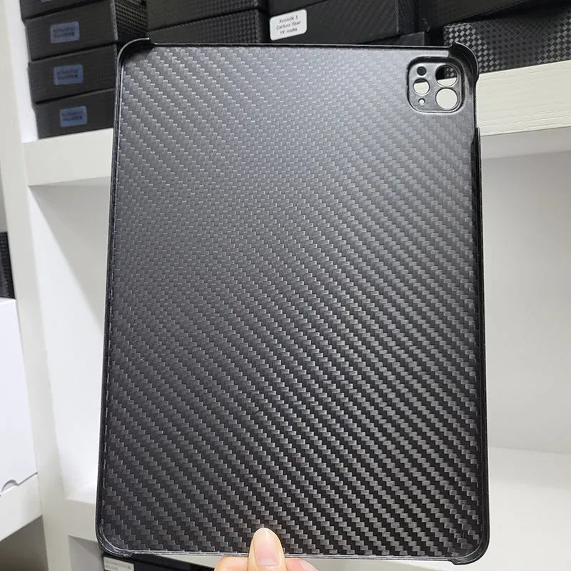 Genuine carbon fibre hard protective case for Apple iPad Pro 11 on a table.