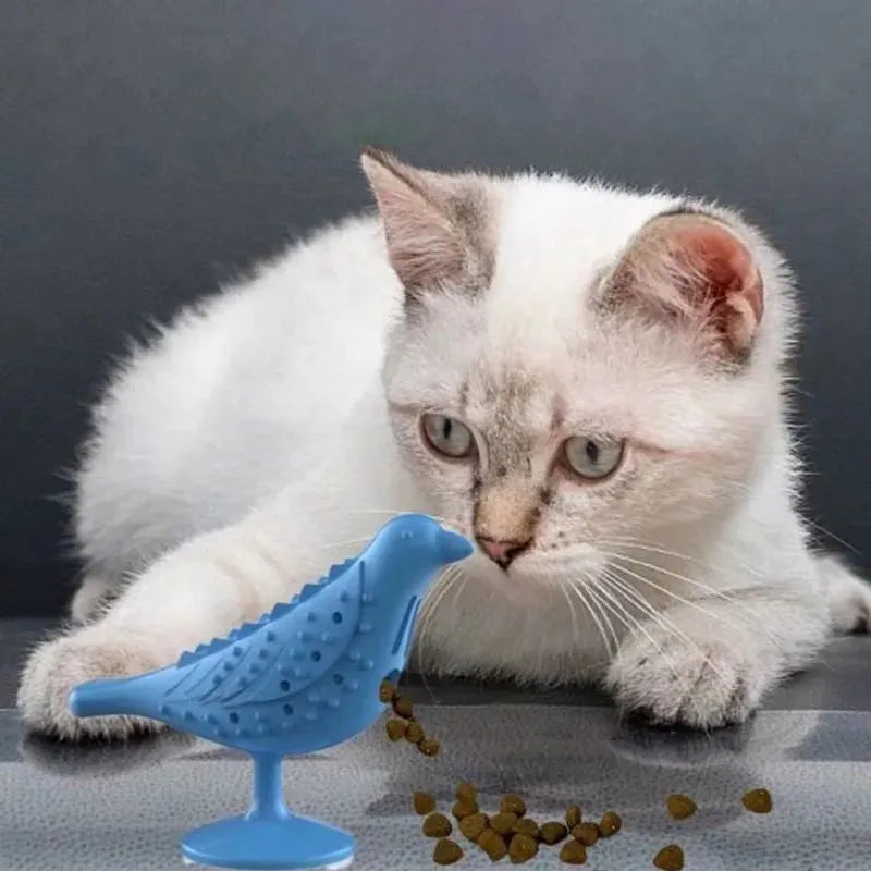 Blue bird shape interactive cat toy with suction cup base on a floor