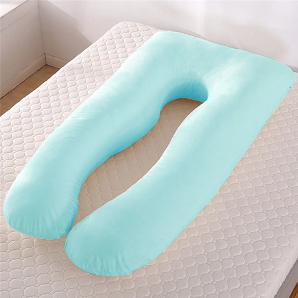 U-shaped white maternity pillow with ice silk cover on a bed, showing its full-body support shape for pregnancy.