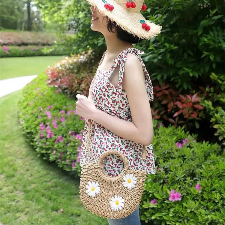 Women's light brown straw-weaved crossbody bag with daisy decoration measuring 25x20x8cm