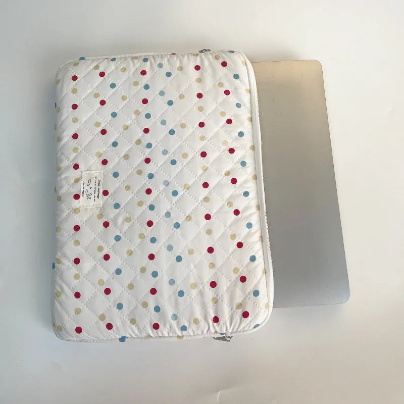 Women's polka dot laptop bag in solid colour with size options for 11, 13, and 15.6 inch computers.