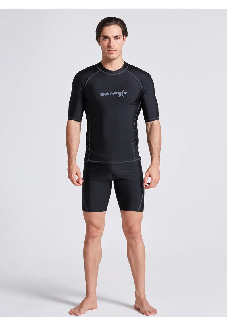 Men's quick-dry half sleeve swimsuit suit for snorkelling, showing separate nylon top and pants.