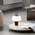 Minimalist glass bedside lamp with Nordic style on a table, showing its 230x330mm size.
