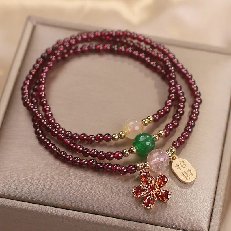 Natural crystal women's bracelet in pomegranate red cherry blossom colour with sequin detail