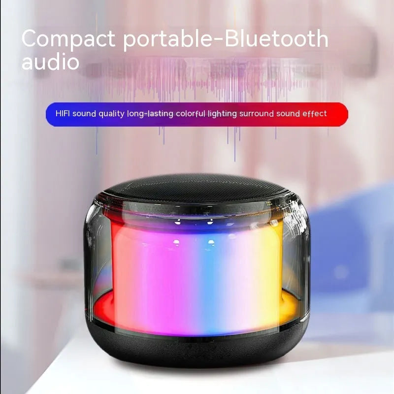 Black gun-shaped Bluetooth speaker with SD card slot and compact desktop design