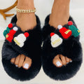 Women's Christmas hat slippers with hairy faux plush upper on a rubber sole.