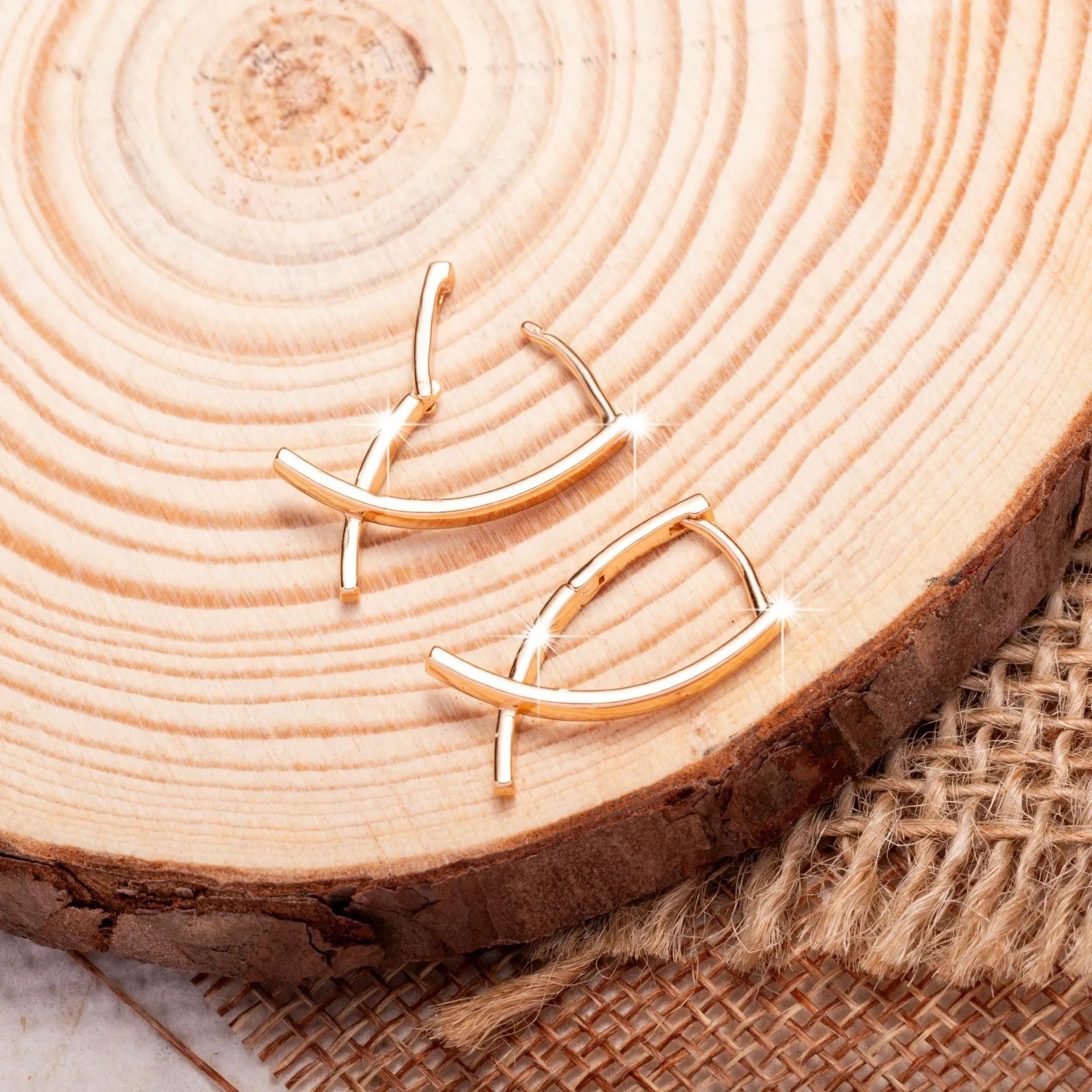 Rose gold cross shaped earrings on a copper base, light luxury style