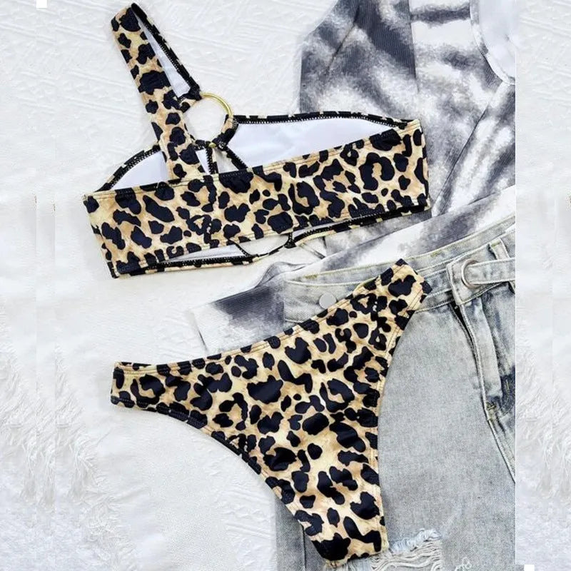 Women's leopard print bikini set with separate top and shorts on a mannequin