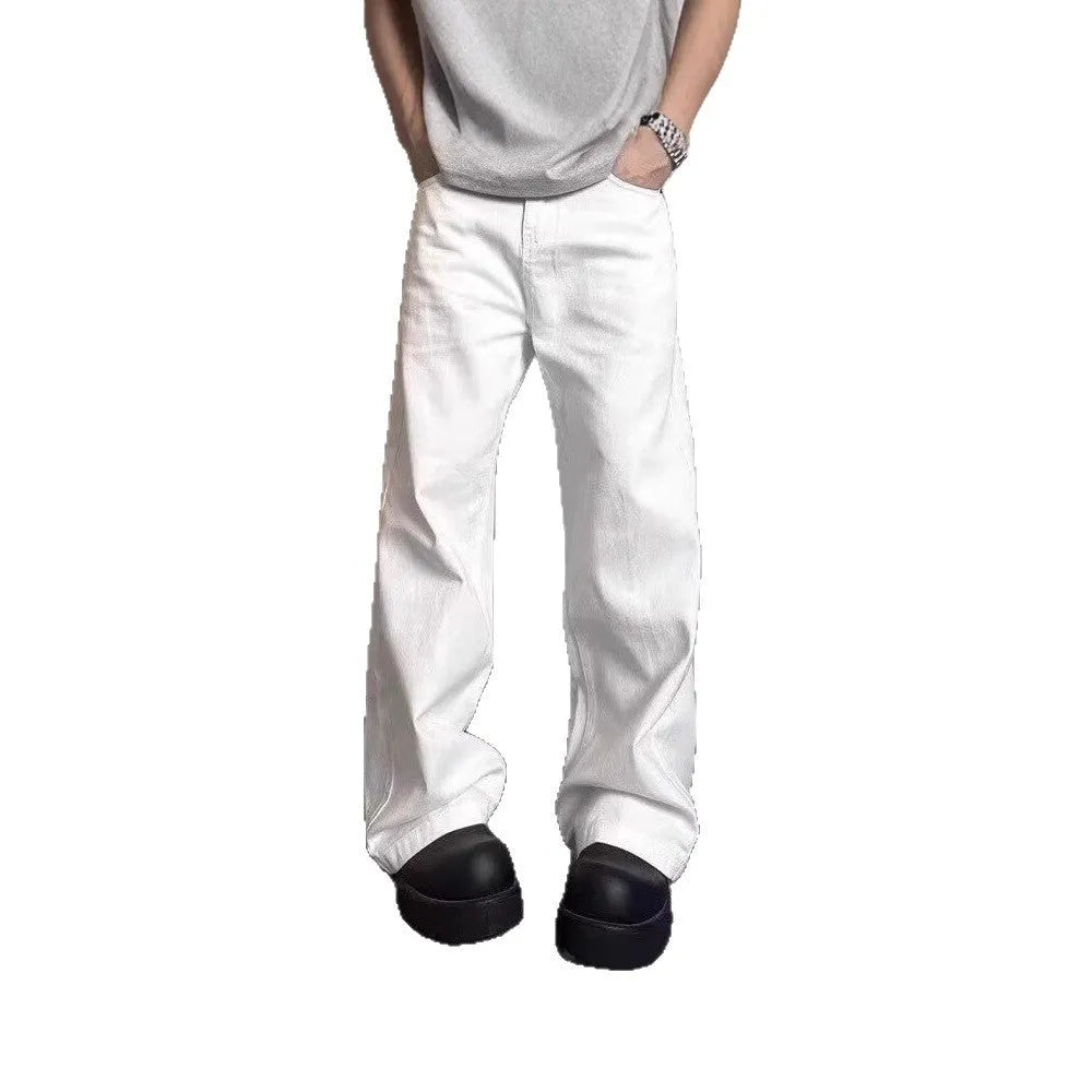Men's loose straight wide leg white cotton denim jeans on a plain background