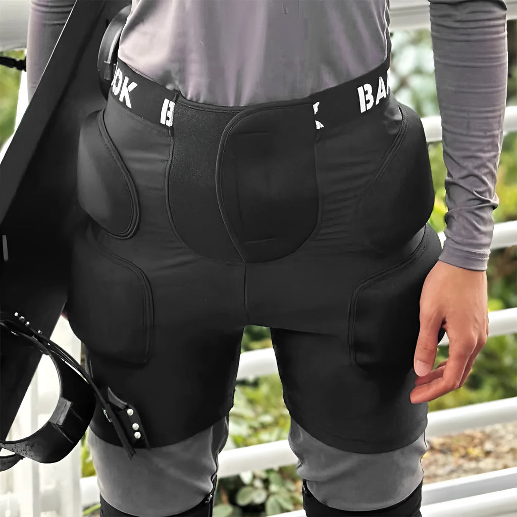 Black adult hip pad for sports protection, showing adjustable waistband and NBR padding on Spandex material.