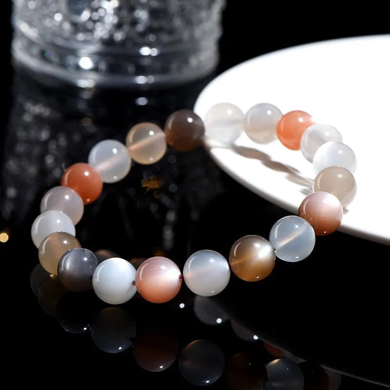 Natural moonstone Duobao bracelet with 8mm beads showcasing a colourful moonlight effect on an adjustable band.