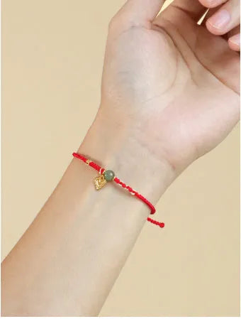 Women's handmade 925 silver and Hetian jade bracelet with adjustable woven cord strap