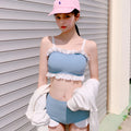 Women's solid colour one-piece swimsuit with suspender straps, designed for swimming.