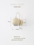 Cream Nordic style bedside wall lamp with magnetic suction base showing 5W warm light