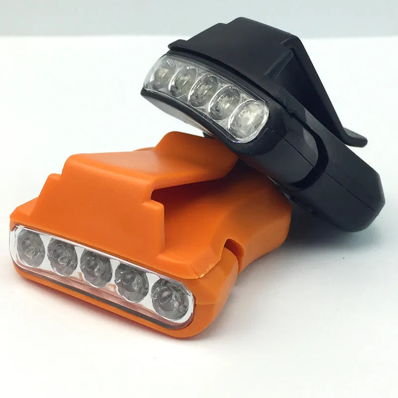 5LED ABS plastic cap lamp clipped to a cap brim, measuring 5x4.5cm, available in black or orange for outdoor use