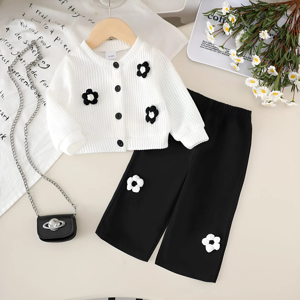 White floral long sleeve top and black trousers baby outfit set in cotton, sizes 6-9M to 2-3Y