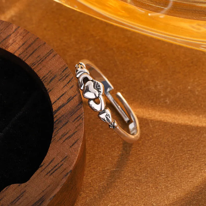 Retro silver copper open ring for women featuring a detailed heart shape design on an adjustable band.