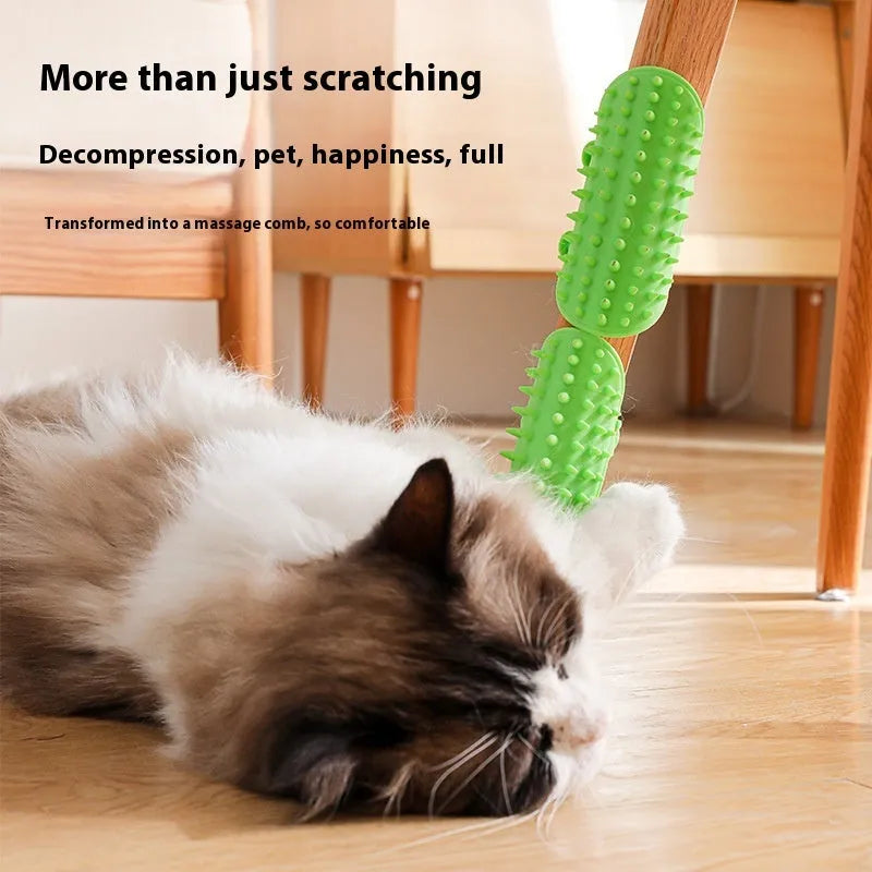 Black silicone cat grooming comb with rounded teeth and adjustable mounting strap for table legs.