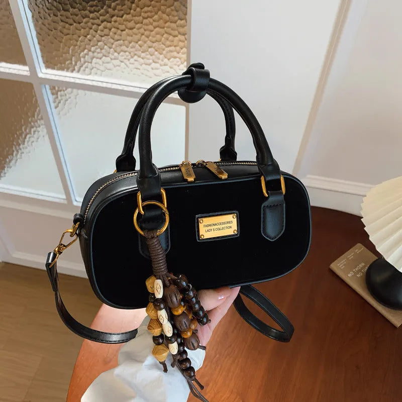 Niche PU one-shoulder messenger bag with stitching horizontal square shape and pendant