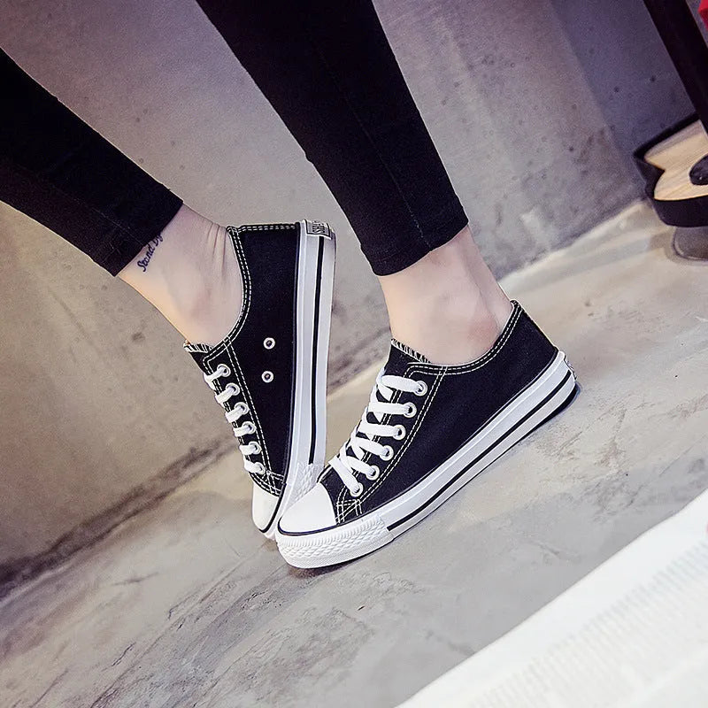 Women's solid colour casual canvas shoes in a lace-up style on a white background.