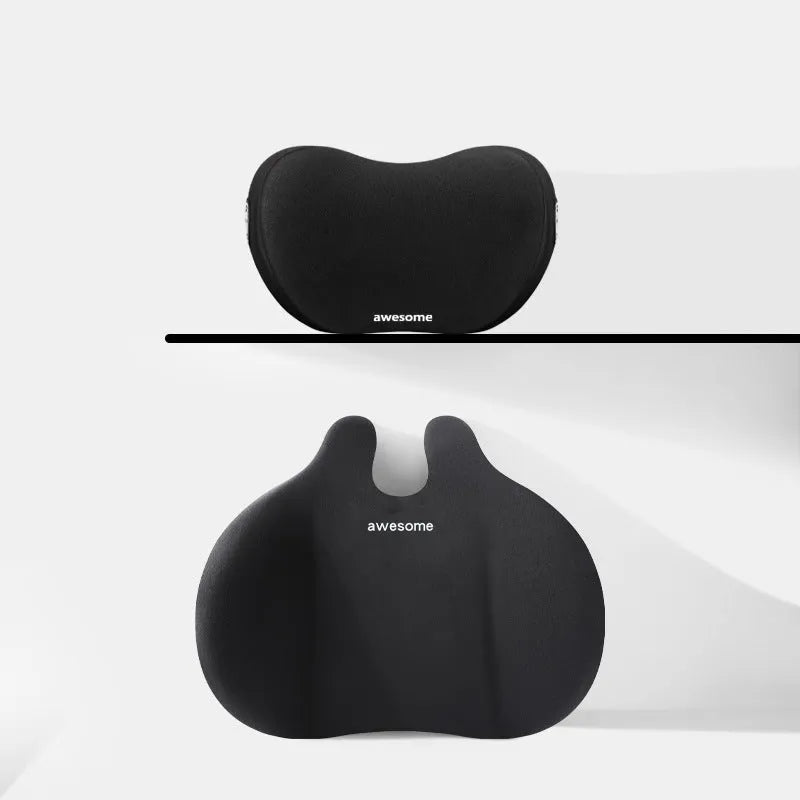 Black car headrest and lumbar support pillow set with cow head design pattern.