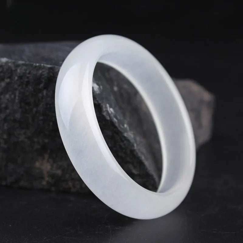 Gao Bing jade bracelet in white moonlight colour on a wrist, showing flat and round bar shape options.
