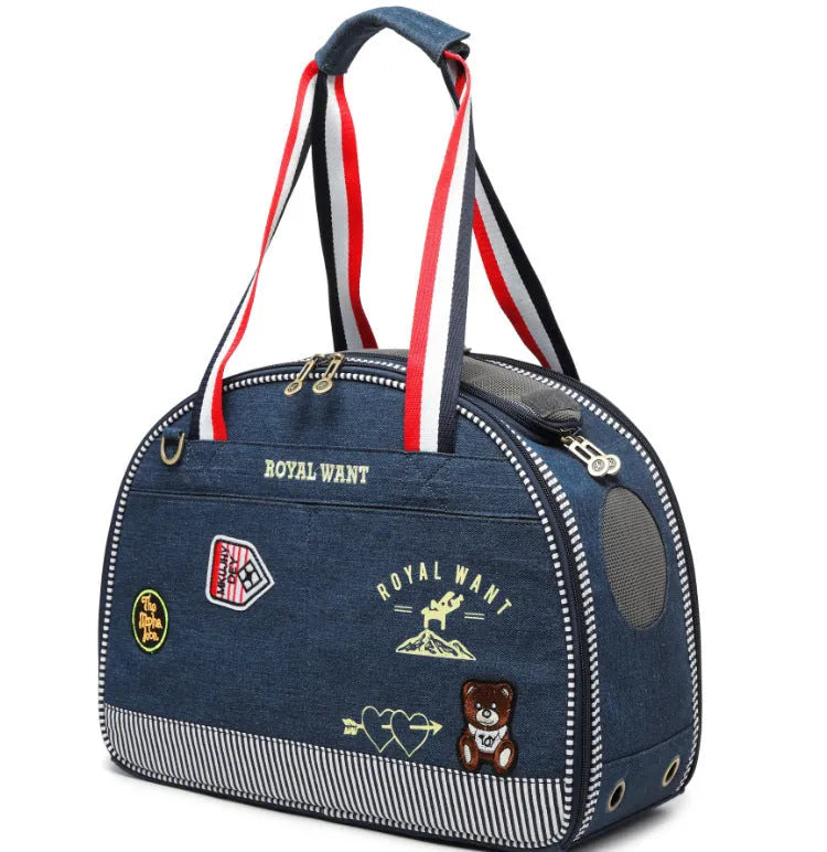Blue denim pet carrier bag with cartoon pattern measuring 43cm by 20cm by 30cm