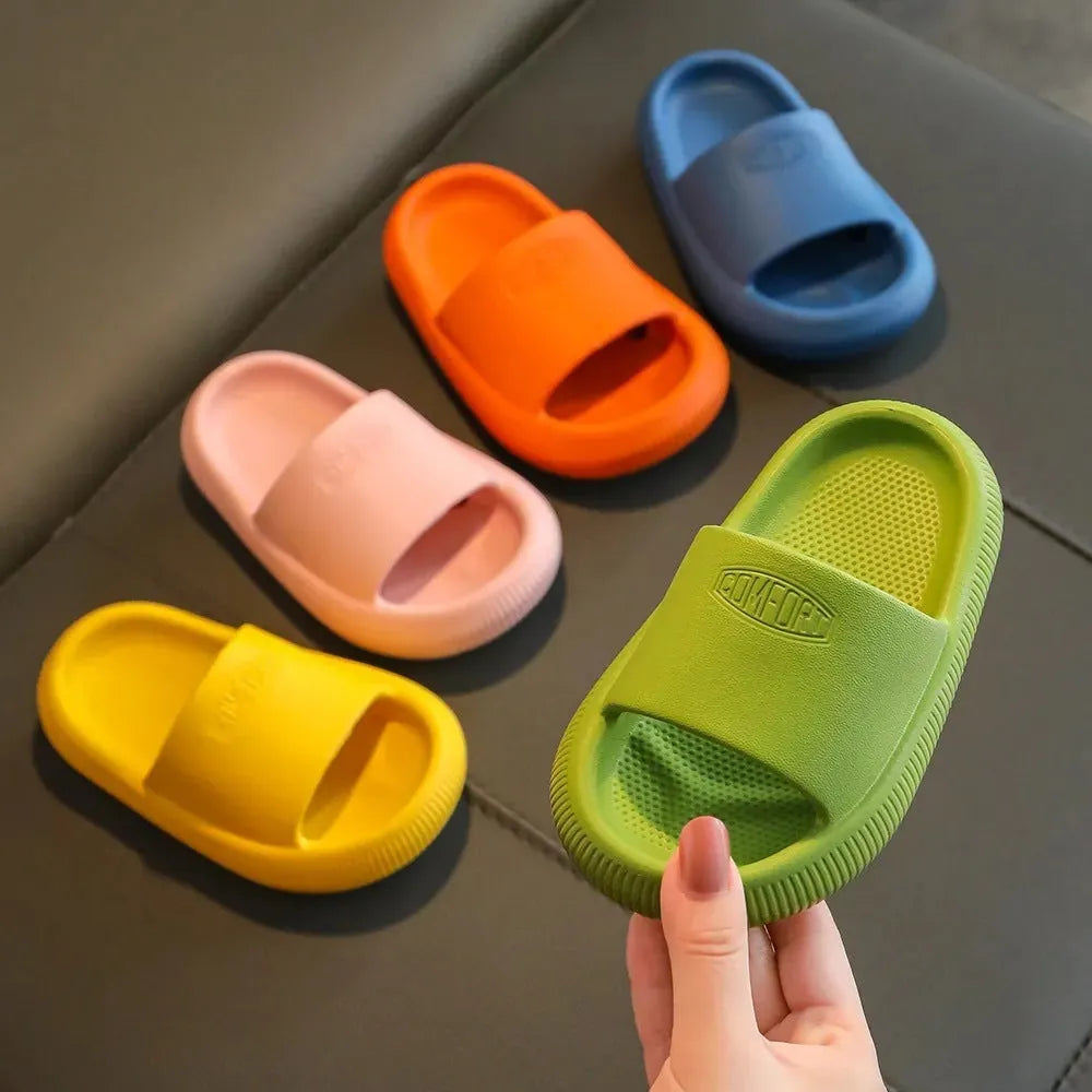 Children's colourful EVA slippers with a non-slip sole on a white background.