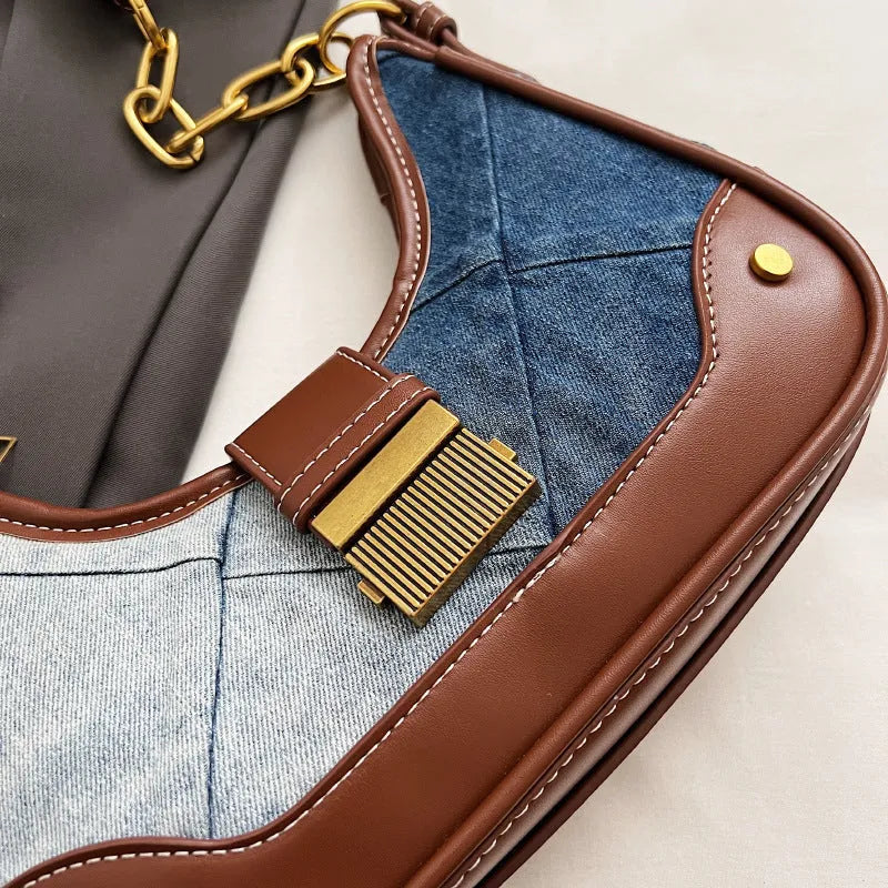 Brown denim women's bucket shoulder bag with diamond mesh detail and chain strap connector.