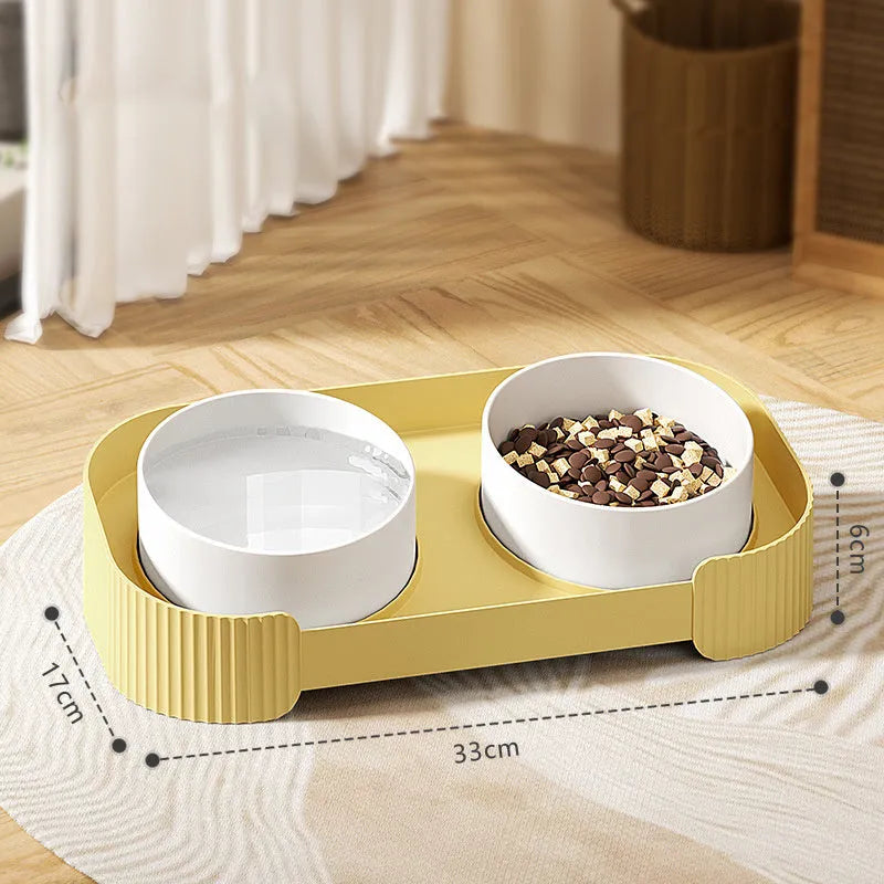 Green ceramic raised cat bowl set with two bowls on a tilted stand and non-slip base.