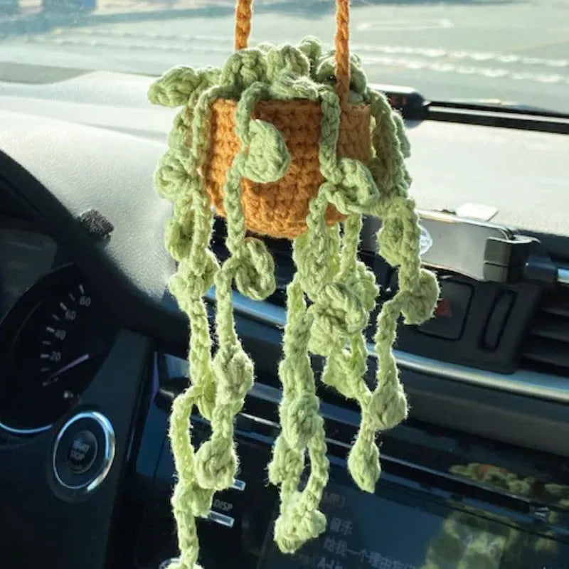 Green and white knitted wool plant ornament for car dashboard with hanging cord