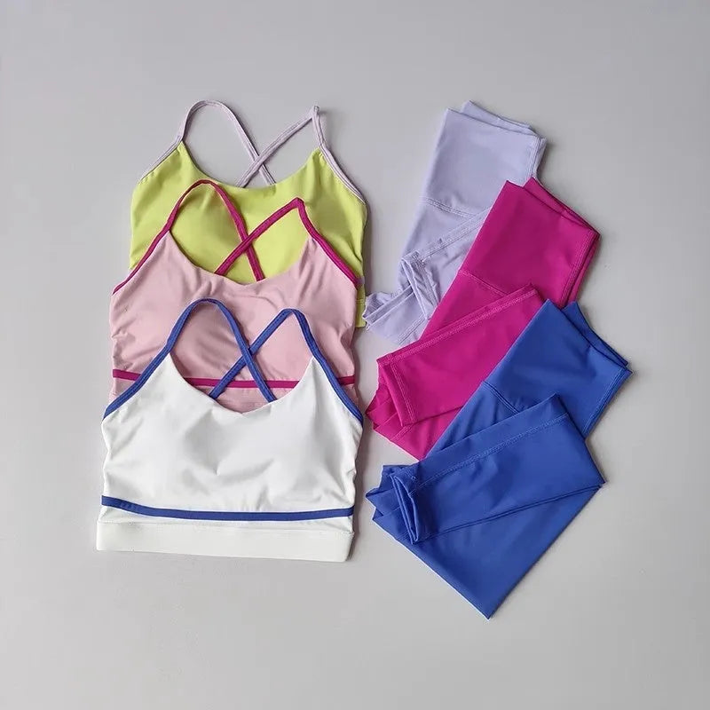Women's two-piece sportswear set with cropped pants and sleeveless tank top in nylon spandex fabric
