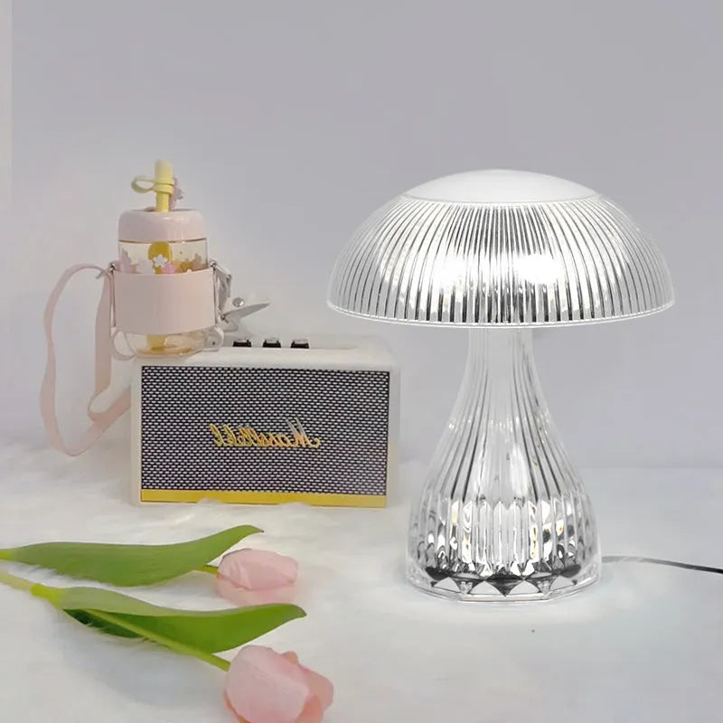 White acrylic touch night lamp with USB charging port on a wooden table.