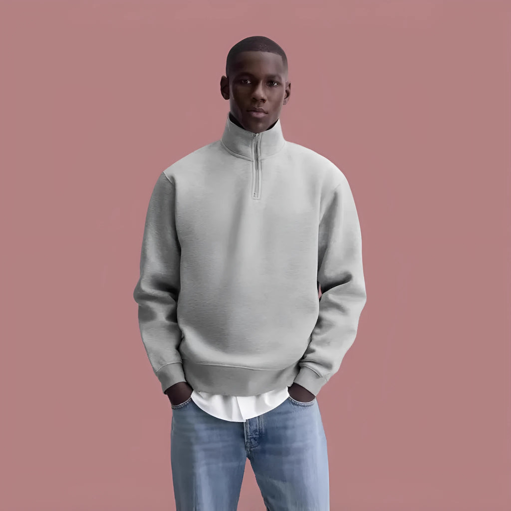 Grey half-zip stand collar cotton sweater with long sleeves on a hanger