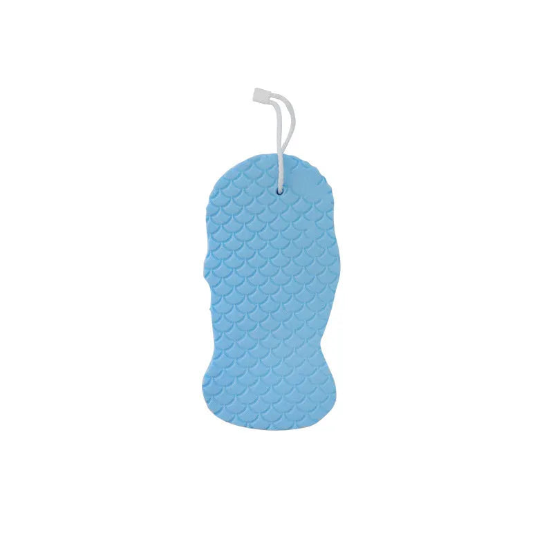 White 3D bath sponge with fish scale pattern for gentle body exfoliation in shower.