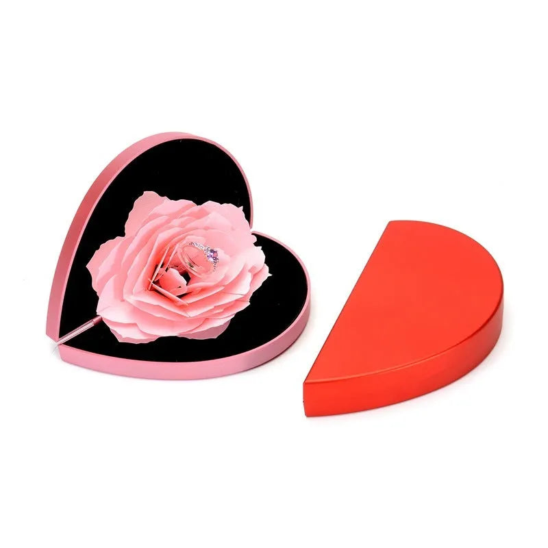 Red rotating ring box with 3D heart-shaped rose decoration for jewellery display