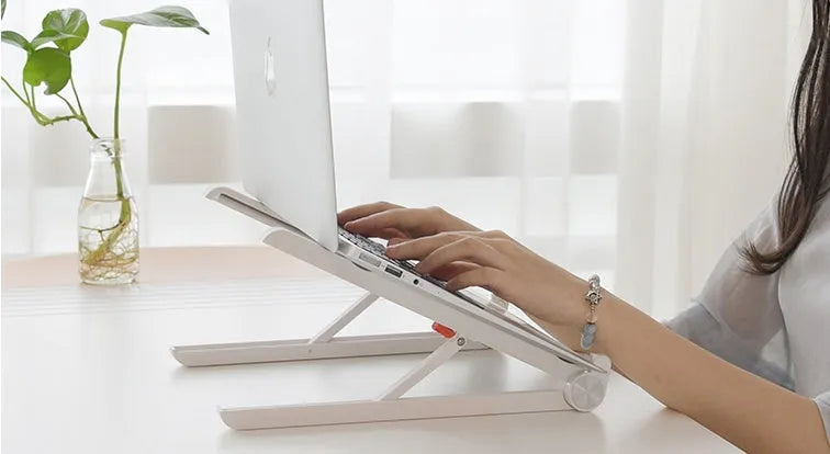 White Whale Race adjustable laptop stand with cooling radiator base for Apple MacBook.