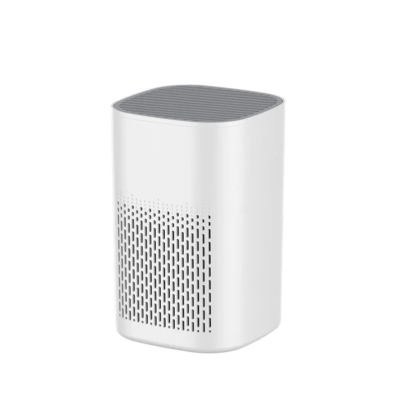 Compact desktop air purifier with USB cable on wooden desk