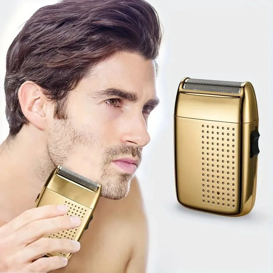Compact reciprocating travel electric shaver in gold or tarnish, rechargeable with 60 minute battery and removable cutter head