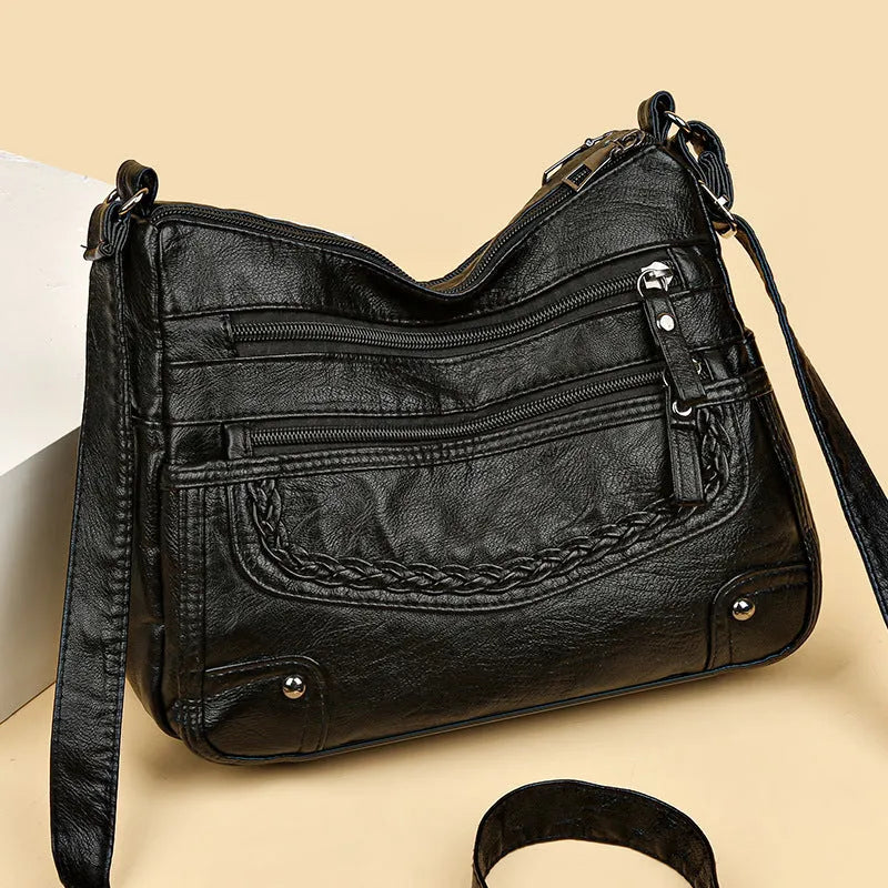 Soft PU messenger bag in horizontal square shape with multiple pockets and sewing thread detailing