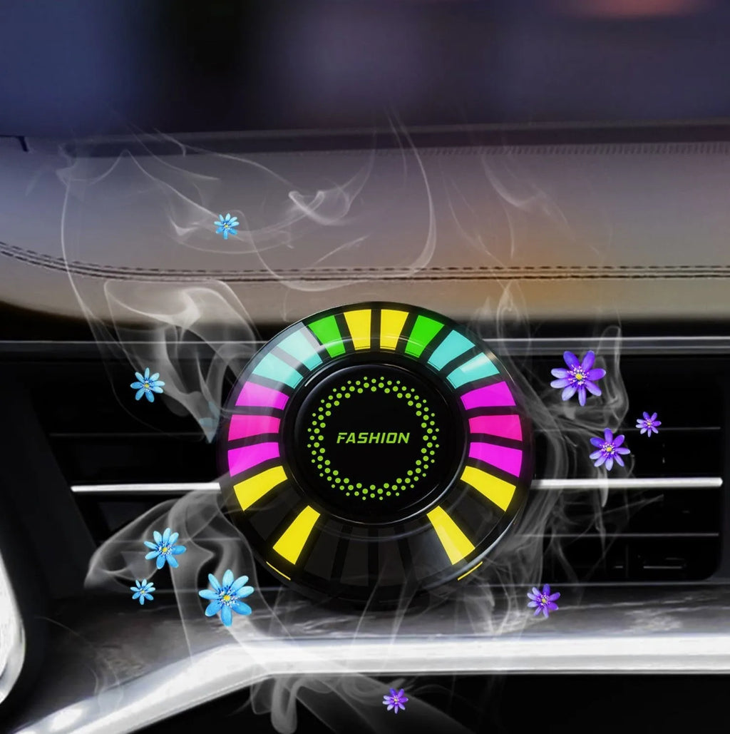 Car air vent aromatherapy light with RGB LEDs and voice control on a car dashboard.