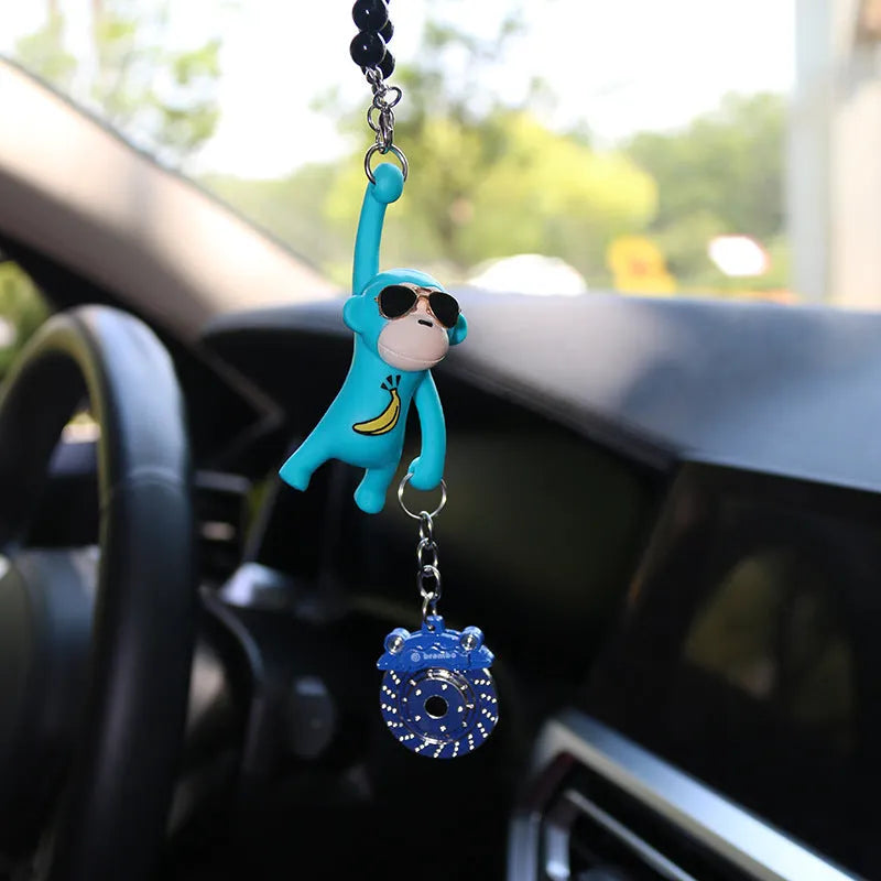 Cartoon monkey wearing sunglasses rearview mirror pendant on a bead necklace.