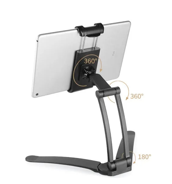 Silver aluminium alloy desktop stand holding a tablet at an angle, with adjustable clips and a white mounting base.