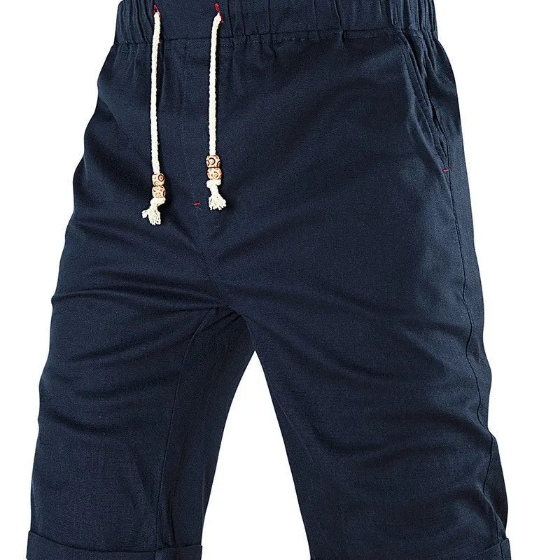 Men's solid colour cotton blend summer shorts with drawstring waist and zipper pocket.