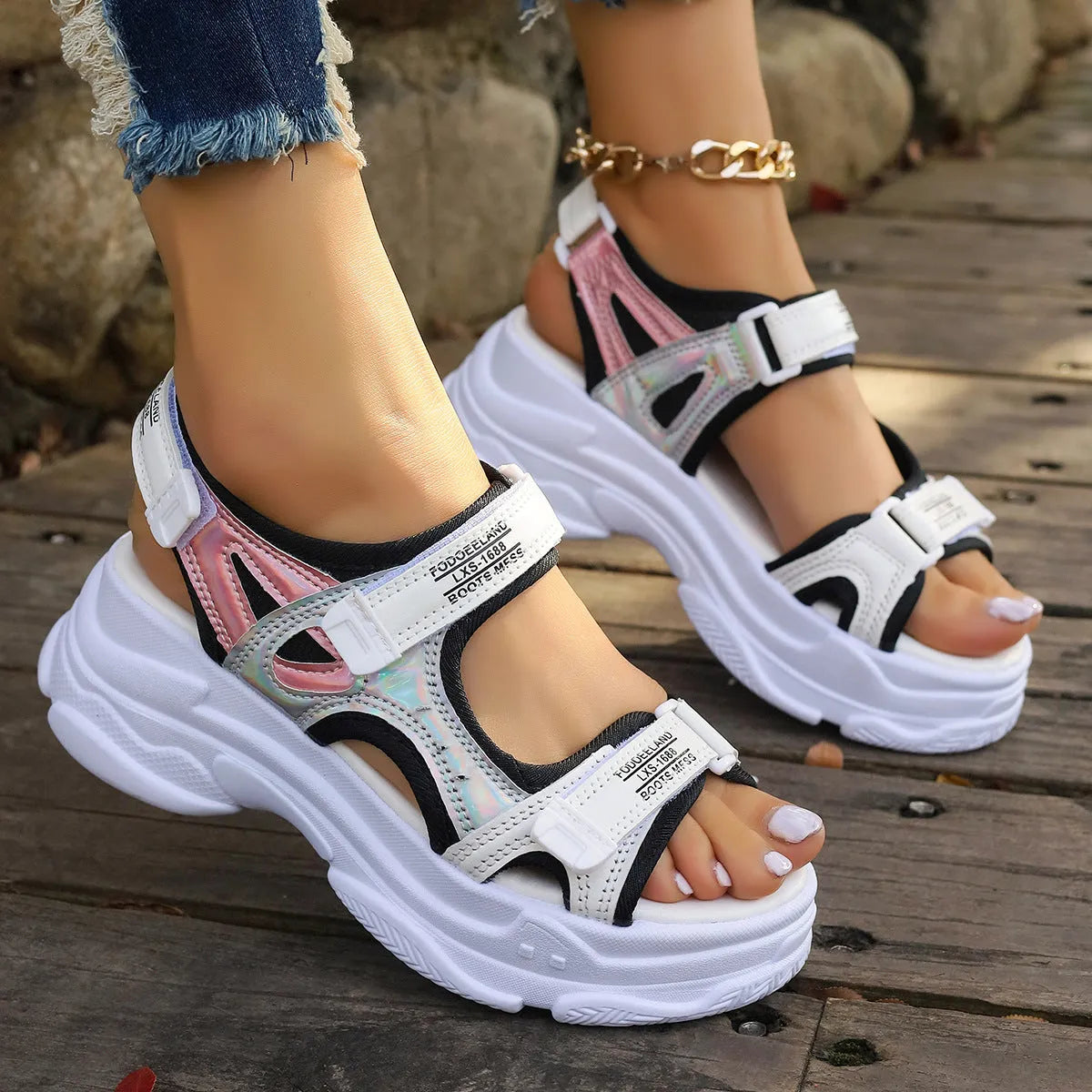 Women's white Roman platform sports sandals with PU upper and rubber sole showing side profile