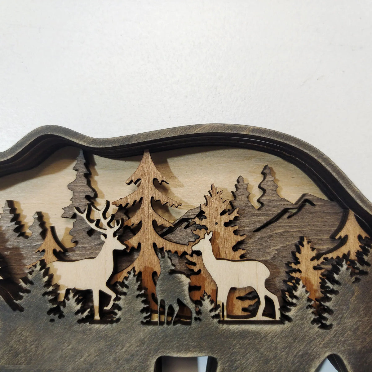 Boxwood Christmas elk ornament 18cm tall with natural wood grain on a wooden shelf