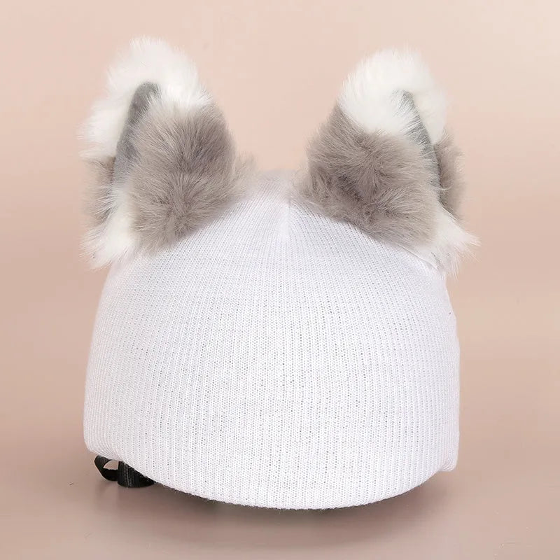 Soft plush cartoon character cover on a motorcycle helmet, showing size M and decorative ear sections.